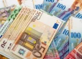 The European Central Bank raised interest rates again but the euro’s gains were limited